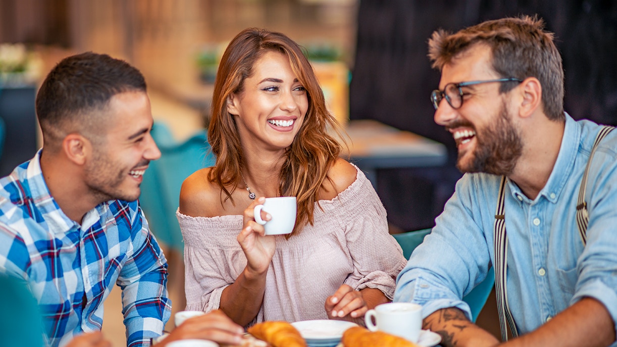 Friends enjoying breakfast at Opéra-Grand Café Capucines in Paris.