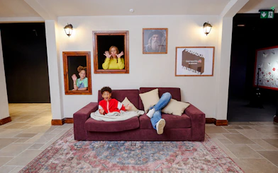 Guests interacting with optical illusions at Paradox Museum London.