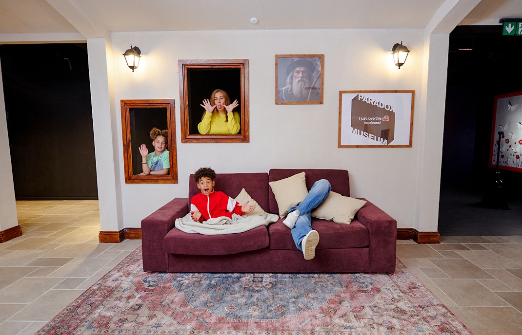 Guests interacting with optical illusions at Paradox Museum London.