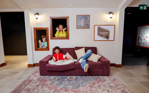 Guests interacting with optical illusions at Paradox Museum London.