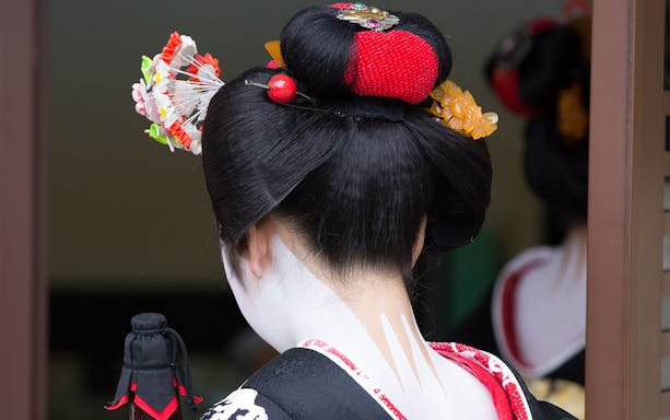 Maiko hairstyle and kimono detail during makeover experience in Kyoto.