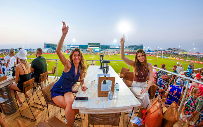 Spectators enjoying the Emirates Dubai 7s from the Sunroom Hospitality area.