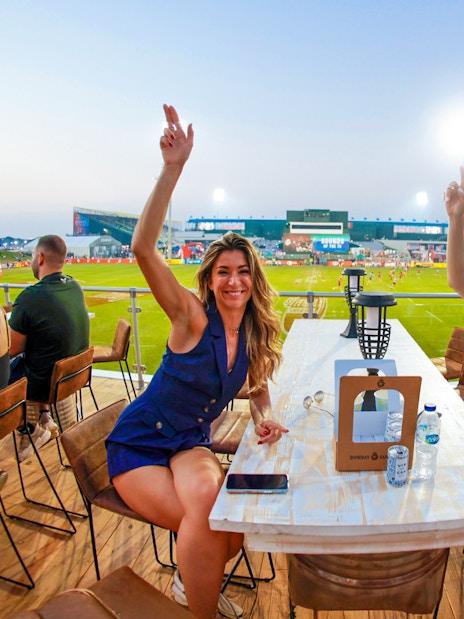 Spectators enjoying the Emirates Dubai 7s from the Sunroom Hospitality area.