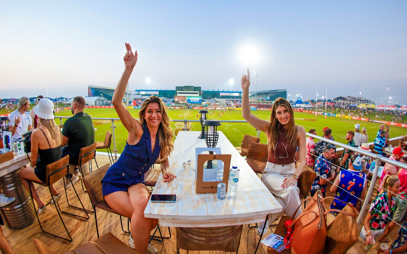 Spectators enjoying the Emirates Dubai 7s from the Sunroom Hospitality area.