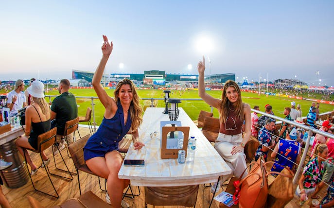 Spectators enjoying the Emirates Dubai 7s from the Sunroom Hospitality area.