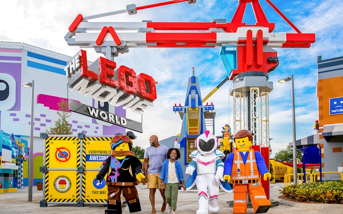 LEGO Movie World entrance with characters and visitors at a theme park in Los Angeles.
