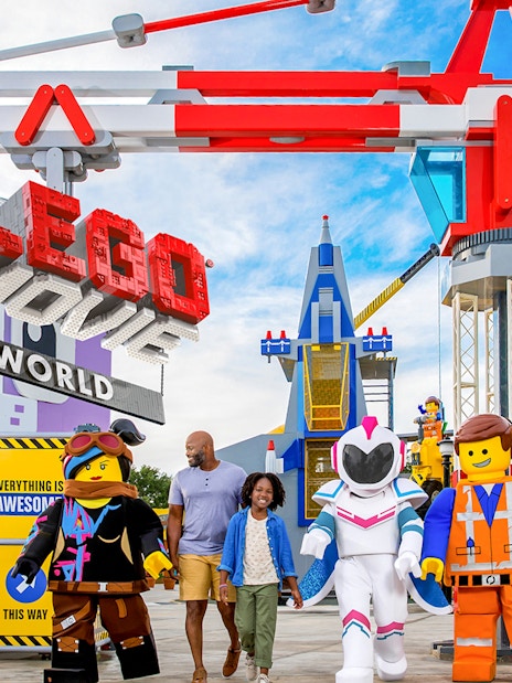 LEGO Movie World entrance with characters and visitors at a theme park in Los Angeles.