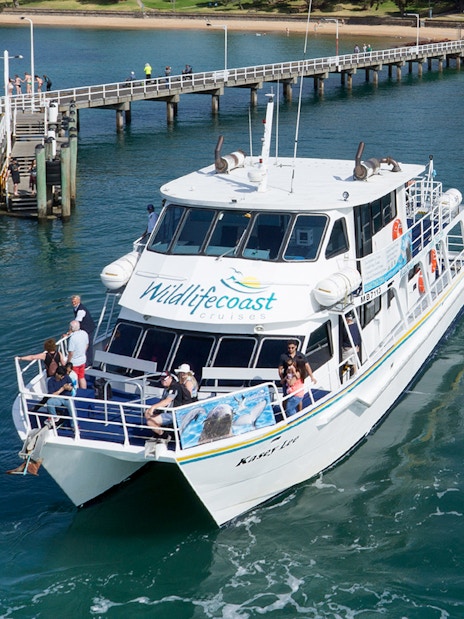 Cruise boat departing pier for seal watching at Phillip Island.