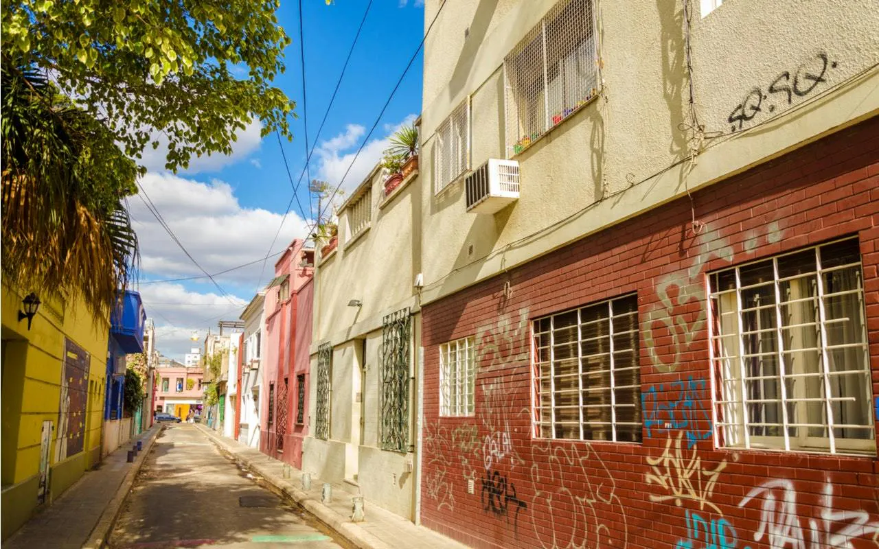 Colorful street with graffiti in Buenos Aires, part of the Avenida de Mayo self-guided city exploration game.