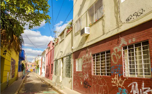 Colorful street with graffiti in Buenos Aires, part of the Avenida de Mayo self-guided city exploration game.