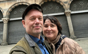 Couple in front of Banca Popolare di Lodi during Milan's Lost Duke city exploration game.