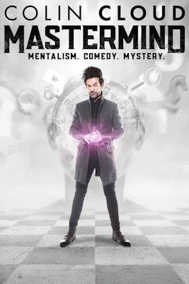 Performer in Colin Cloud Mastermind show, Vegas, with glowing hands and clock backdrop.