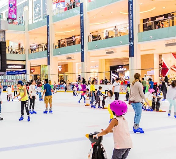 People ice skating at Dubai Ice Rink in a shopping mall.