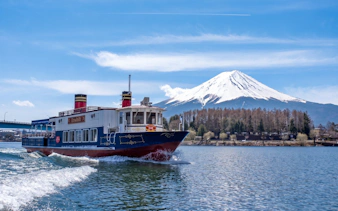 Boat on Lake Kawaguchi with Mount Fuji in the background, Japan.