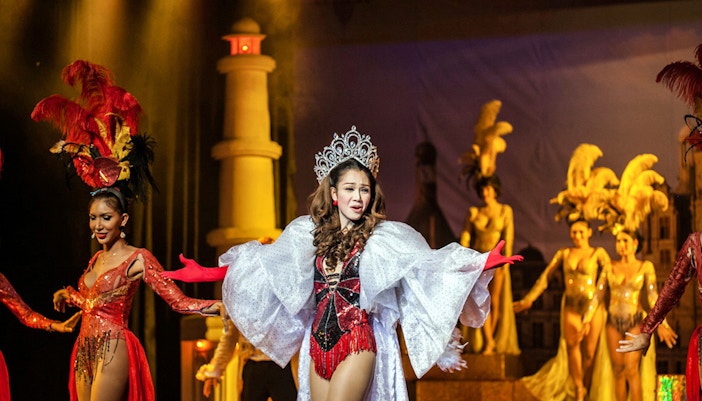 Performers in elaborate costumes on stage at Golden Dome Cabaret, Bangkok.