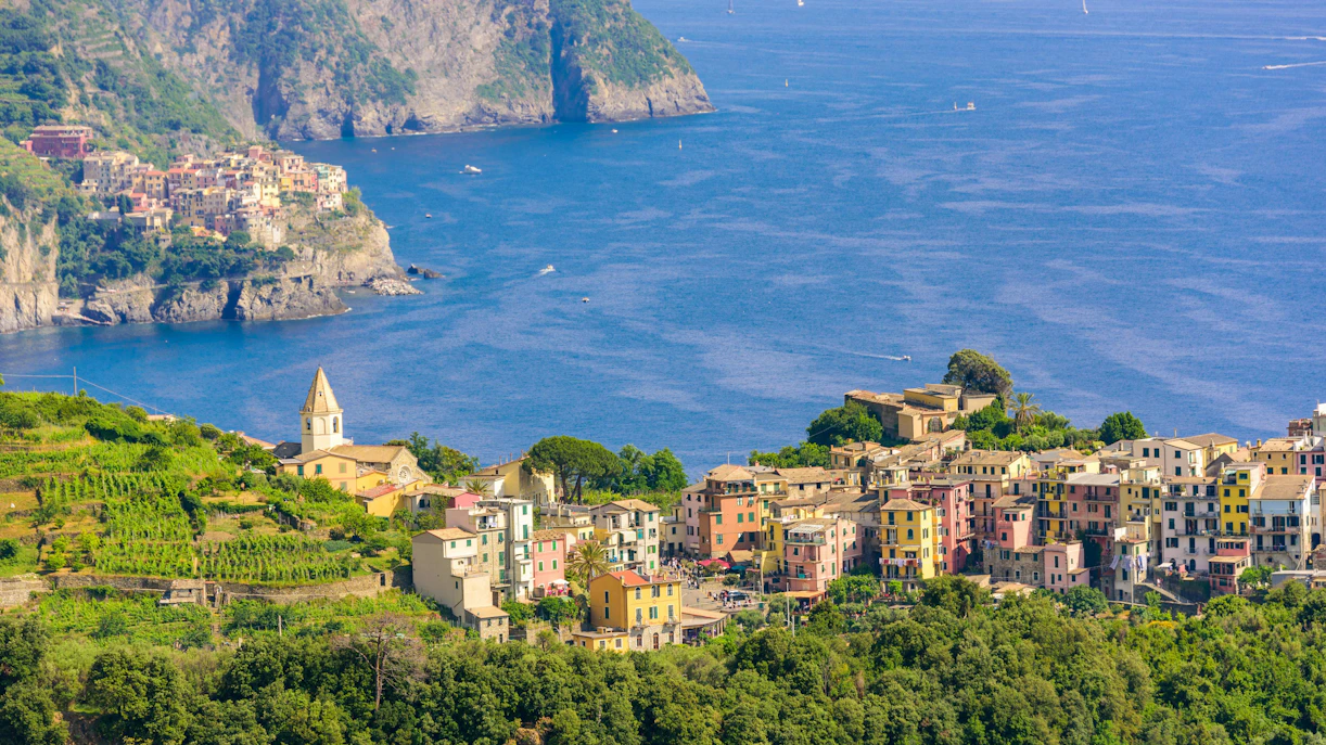 Corniglia village in Cinque Terre National Park with Manarola in the background, Liguria, Italy.