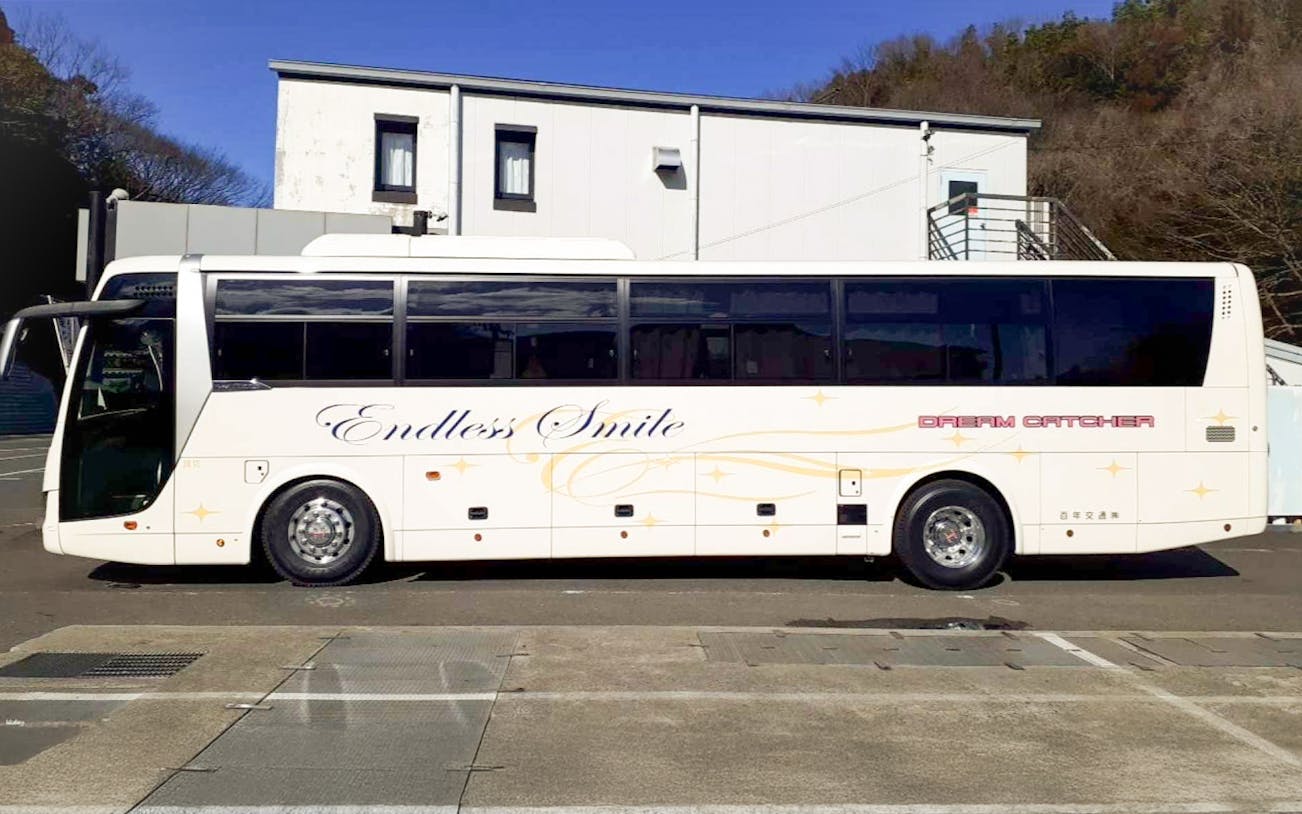 Shinjuku to Tokyo Disney Resort bus parked at station.