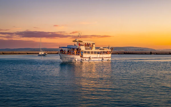From Pula: Sunset and Dolphin Cruise around Brijuni Islands with Drinks & Dinner Option