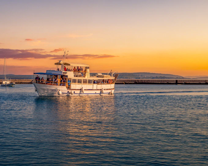 From Pula: Sunset and Dolphin Cruise around Brijuni Islands with Drinks & Dinner Option