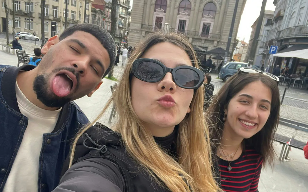 Group enjoying Porto’s Old Town with historic architecture in the background.