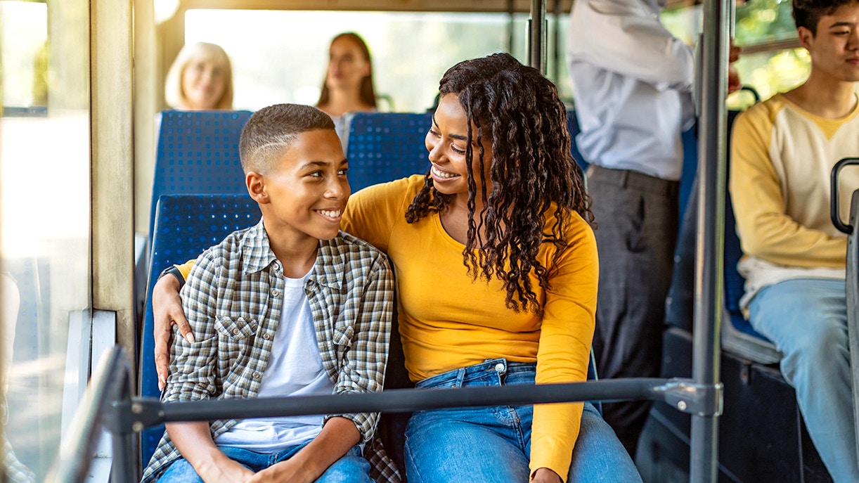 Guests seated inside air-conditioned bus during city tour transfer.