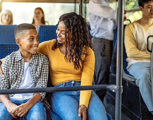 Guests seated inside air-conditioned bus during city tour transfer.
