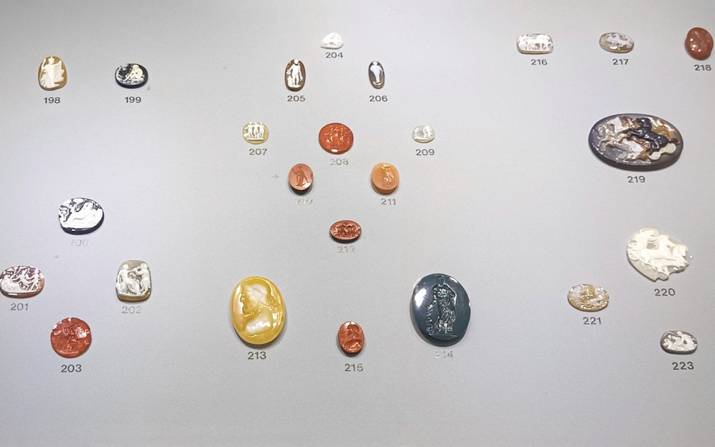 Ancient engraved gems display at Naples National Archaeological Museum.