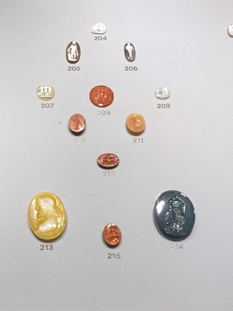 Ancient engraved gems display at Naples National Archaeological Museum.