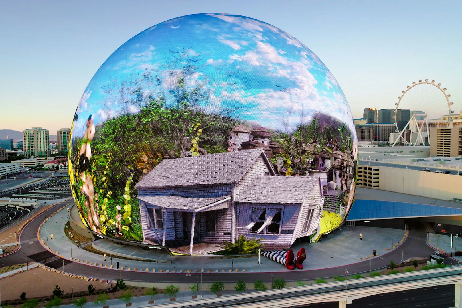 Sphere in Las Vegas displaying Wizard of Oz scene with house and ruby slippers.