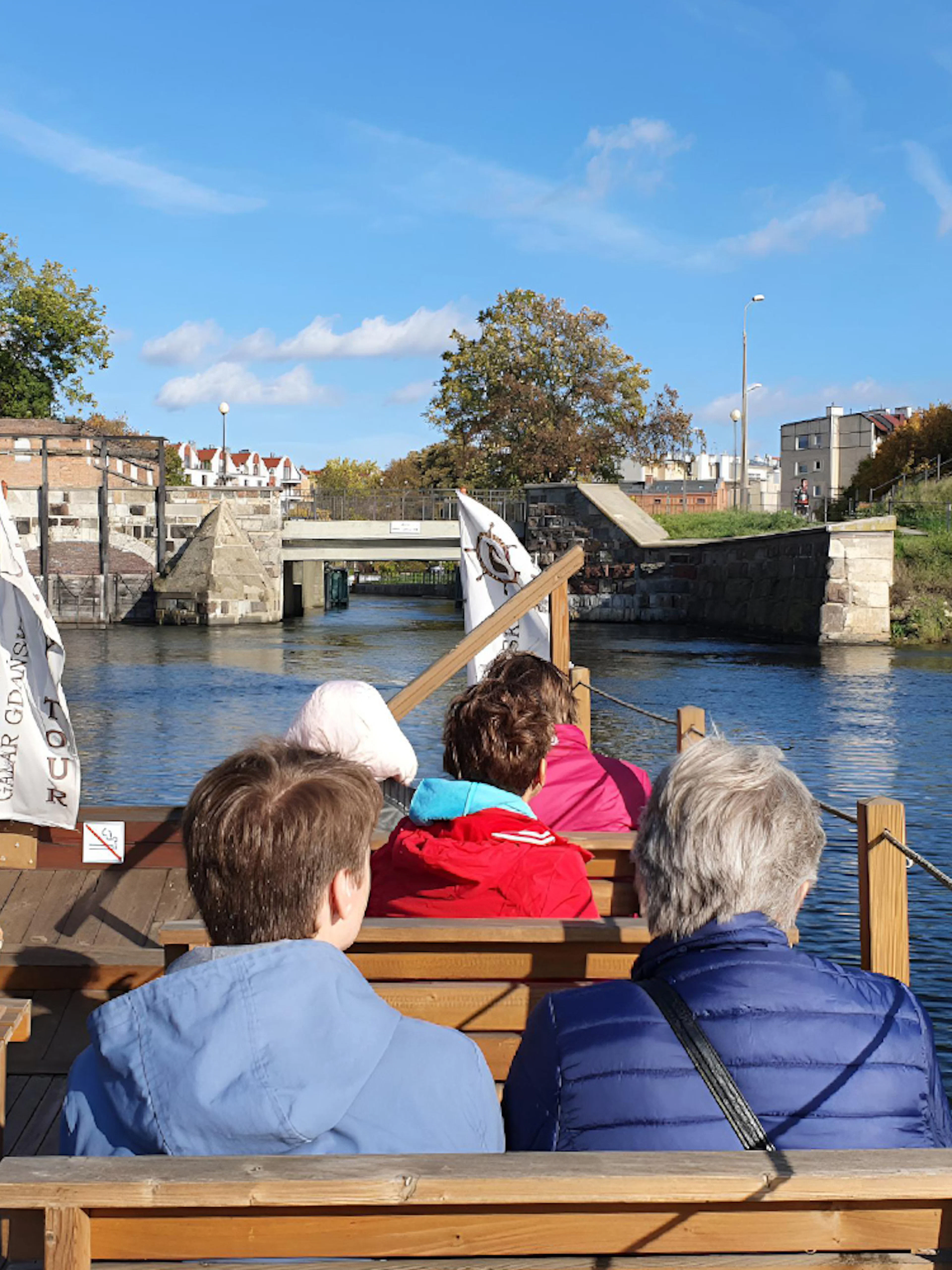 Galar Cruise passengers view historic canal in Gdansk.