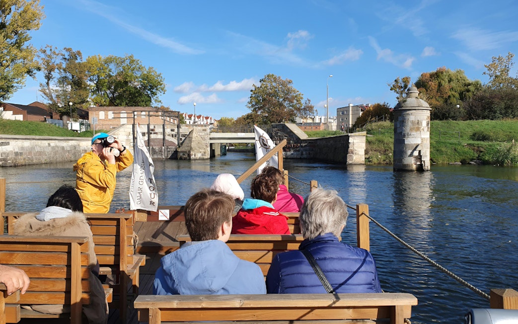 Galar Cruise passengers view historic canal in Gdansk.