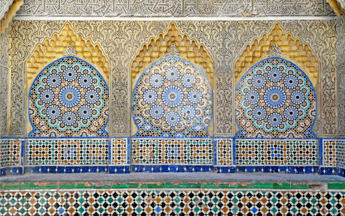Arabic mosaic patterns in Tanger medina, featuring intricate geometric designs.