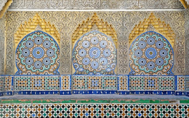 Arabic mosaic patterns in Tanger medina, featuring intricate geometric designs.