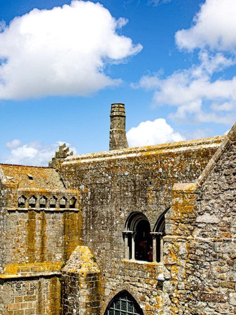Mont-Saint-Michel Abbey stone architecture with coastal view in Normandy, France.