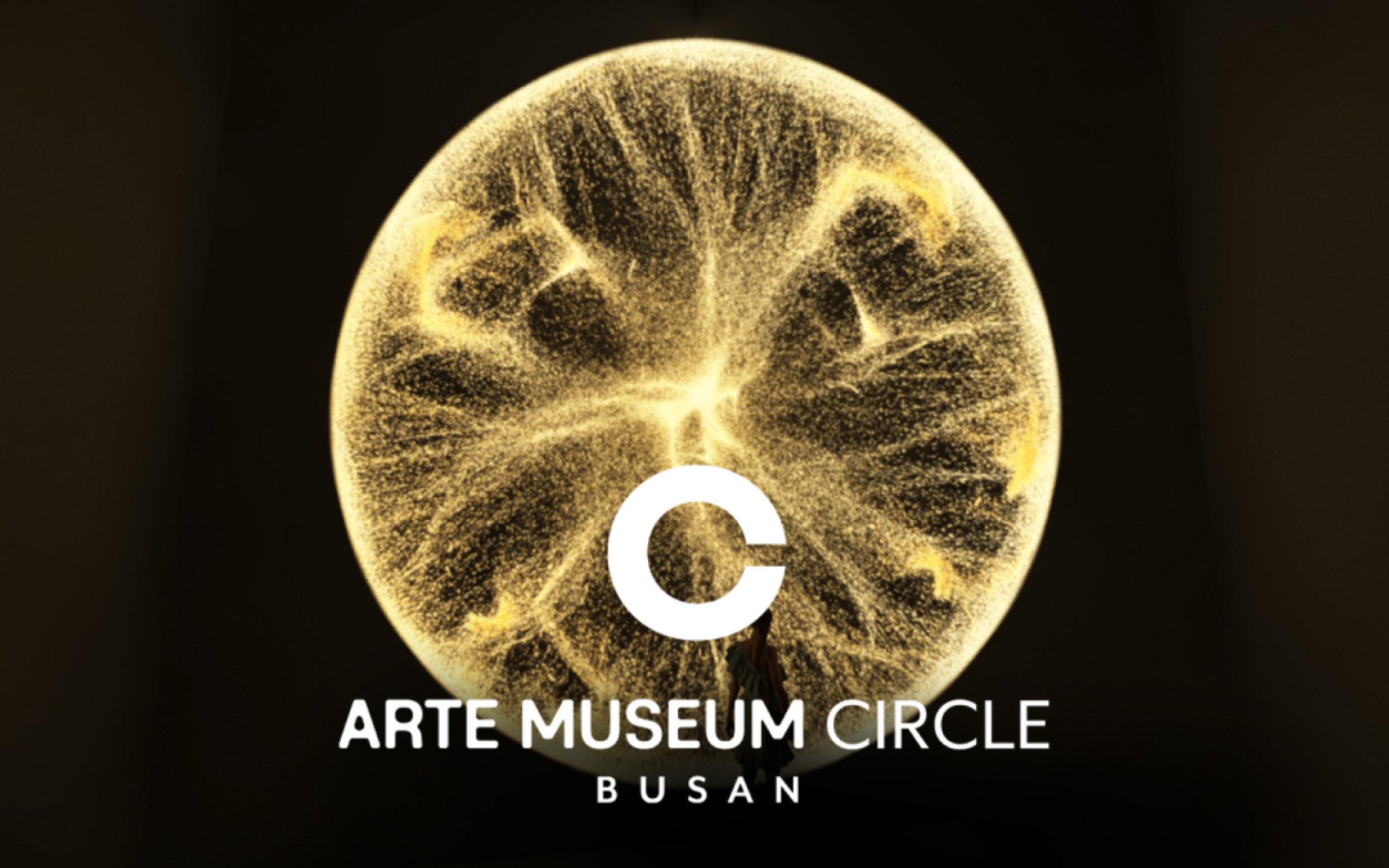 Arte Museum Busan logo with abstract circular design.