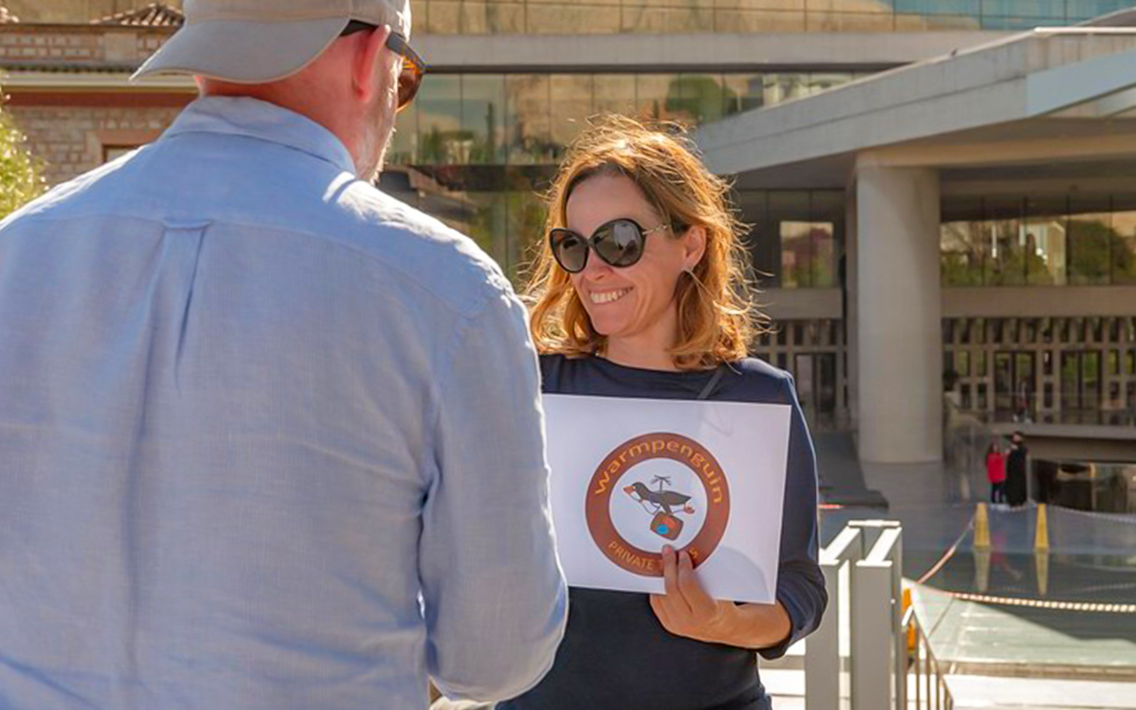 Guide providing information during National Archaeological Museum private tour.