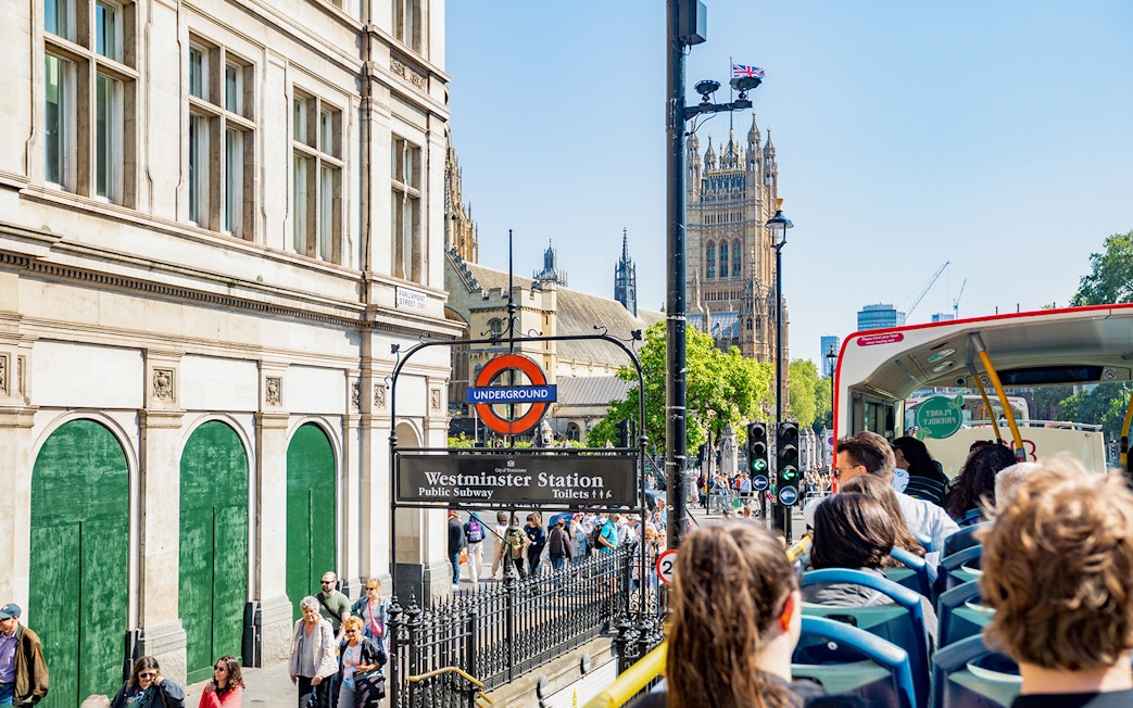 Kids on a Tootbus tour passing Westminster Station and Big Ben in London.