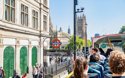 Kids on a Tootbus tour passing Westminster Station and Big Ben in London.