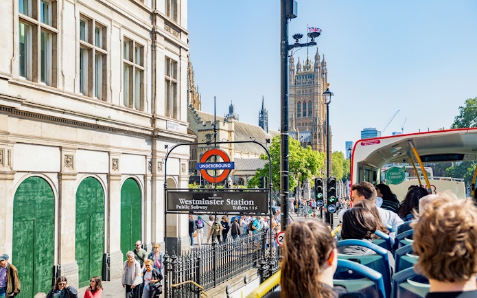 Kids on a Tootbus tour passing Westminster Station and Big Ben in London.
