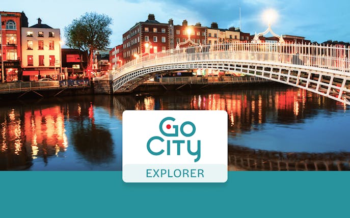 Ha'penny Bridge over River Liffey at dusk, Dublin, Ireland.