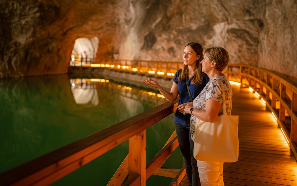 Guided tour of saltwater lake inside Wieliczka salt mine.