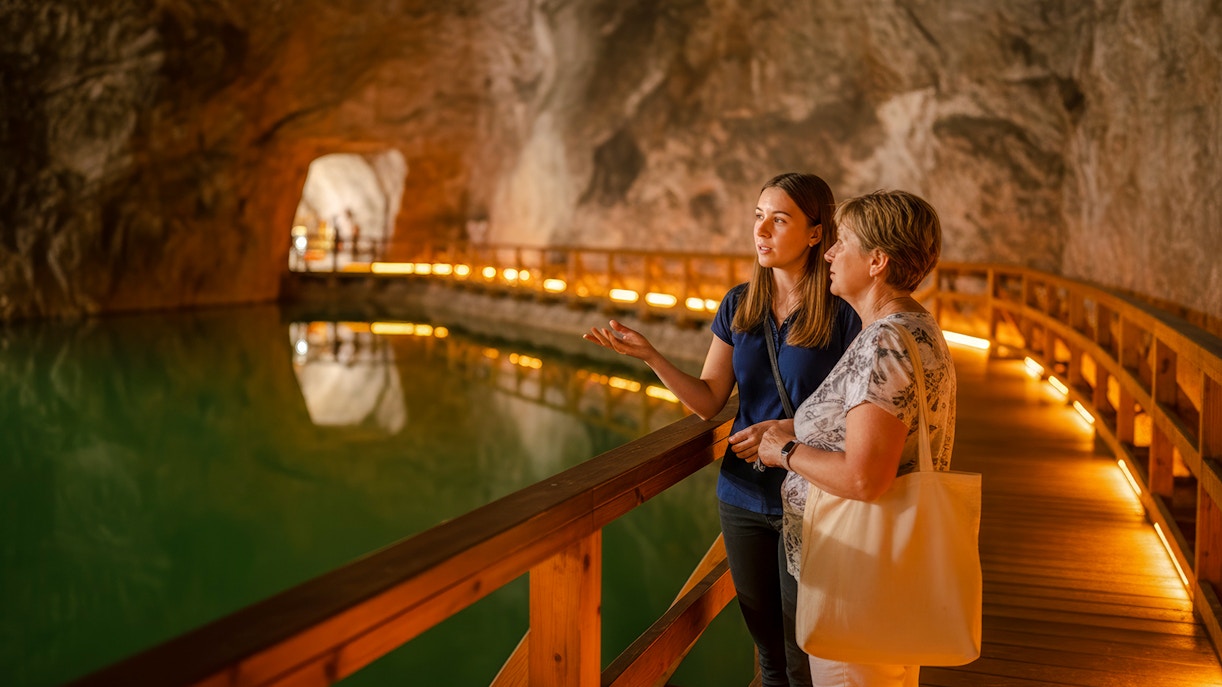 Guided tour of saltwater lake inside Wieliczka salt mine.