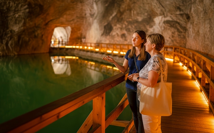 Guided tour of saltwater lake inside Wieliczka salt mine.