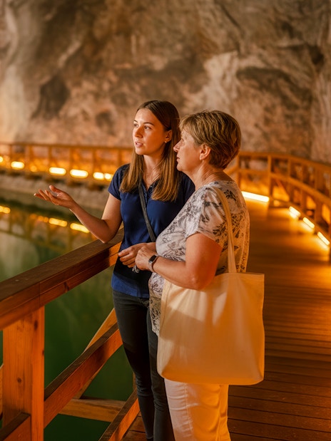 Guided tour of saltwater lake inside Wieliczka salt mine.