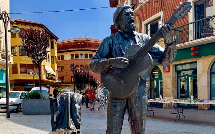 Statue of a guitarist in Gernika town square, part of the San Sebastian tour.