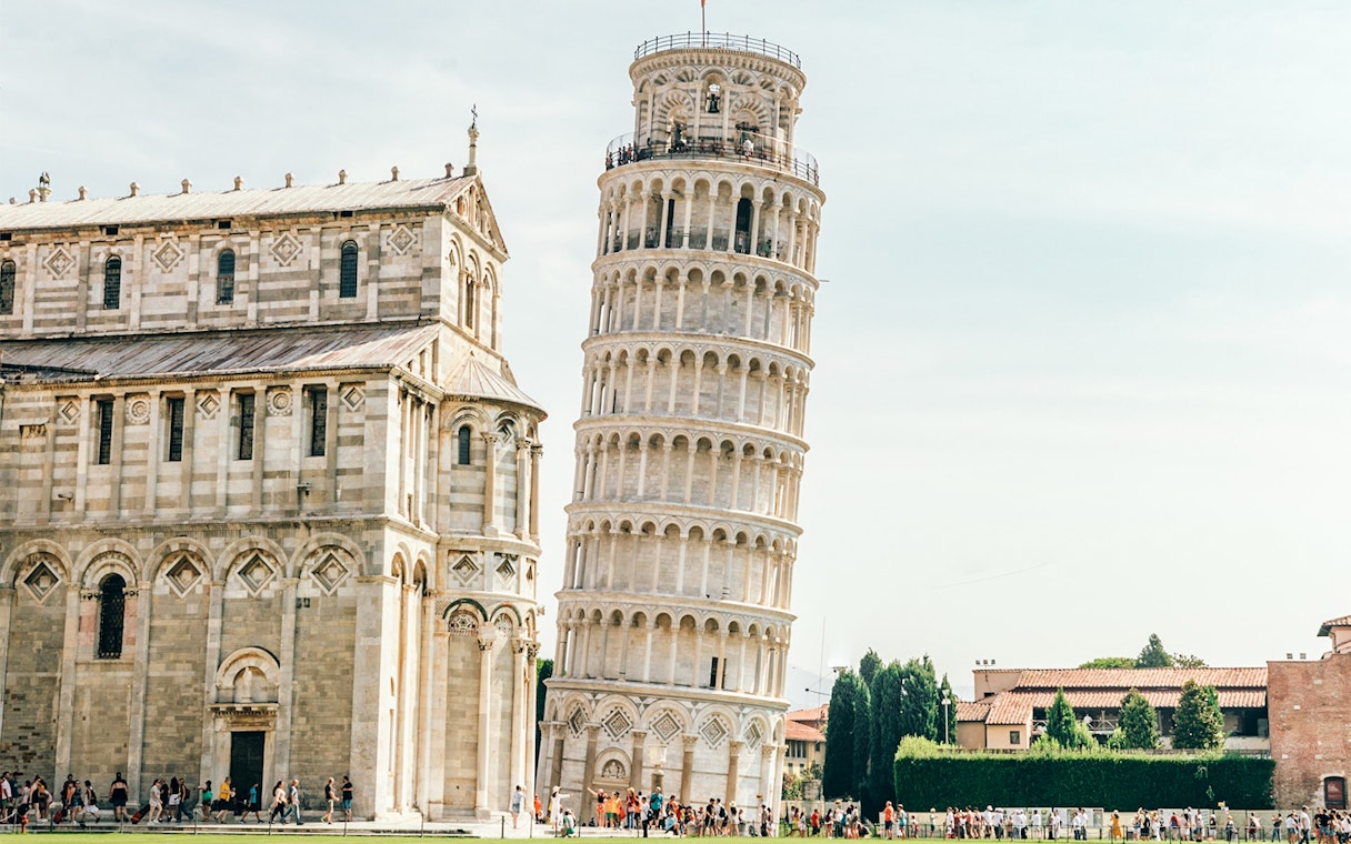 Leaning Tower of Pisa with adjacent cathedral in Pisa, Italy.