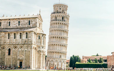 Leaning Tower of Pisa with adjacent cathedral in Pisa, Italy.