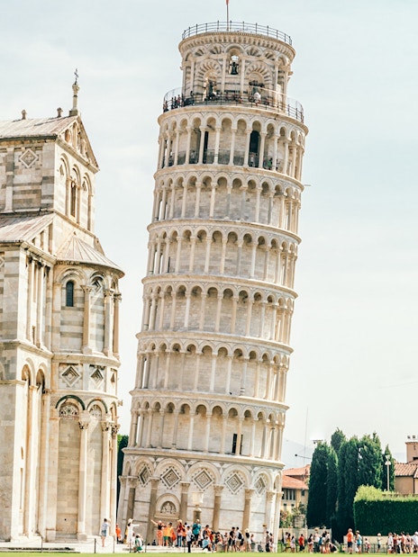 Leaning Tower of Pisa with adjacent cathedral in Pisa, Italy.