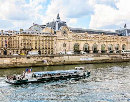 Orsay Museum along the Seine River in Paris, showcasing iconic architecture and riverside views.