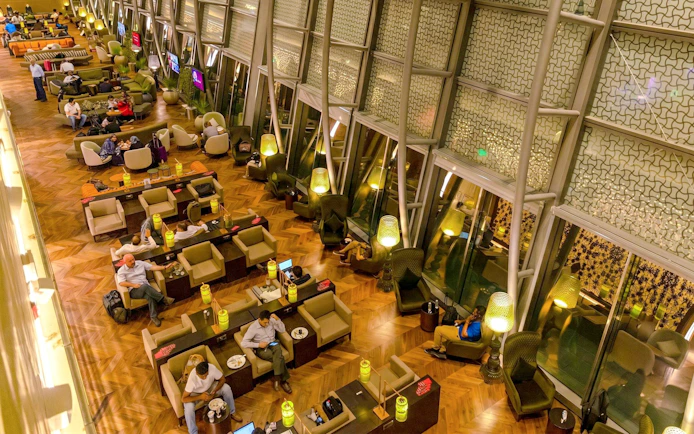 Primeclass Lounge seating area at Muscat International Airport's International Departures.